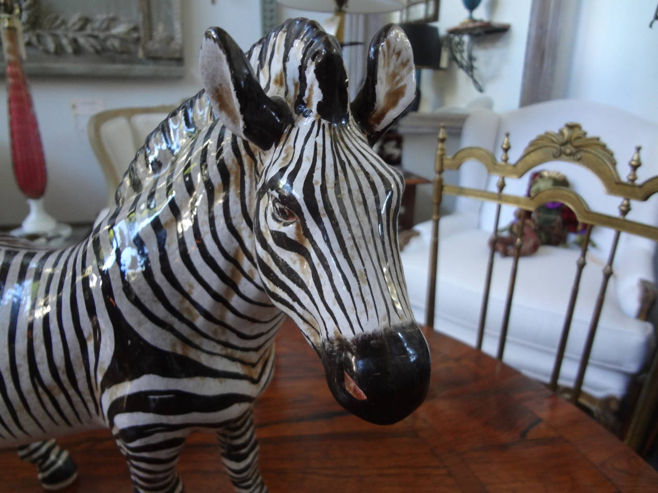 Rare standing Italian Mid Century glazed terra cotta zebra sculpture/statue signed Manlio, Italy. Beautifully decorated and detailed.
 