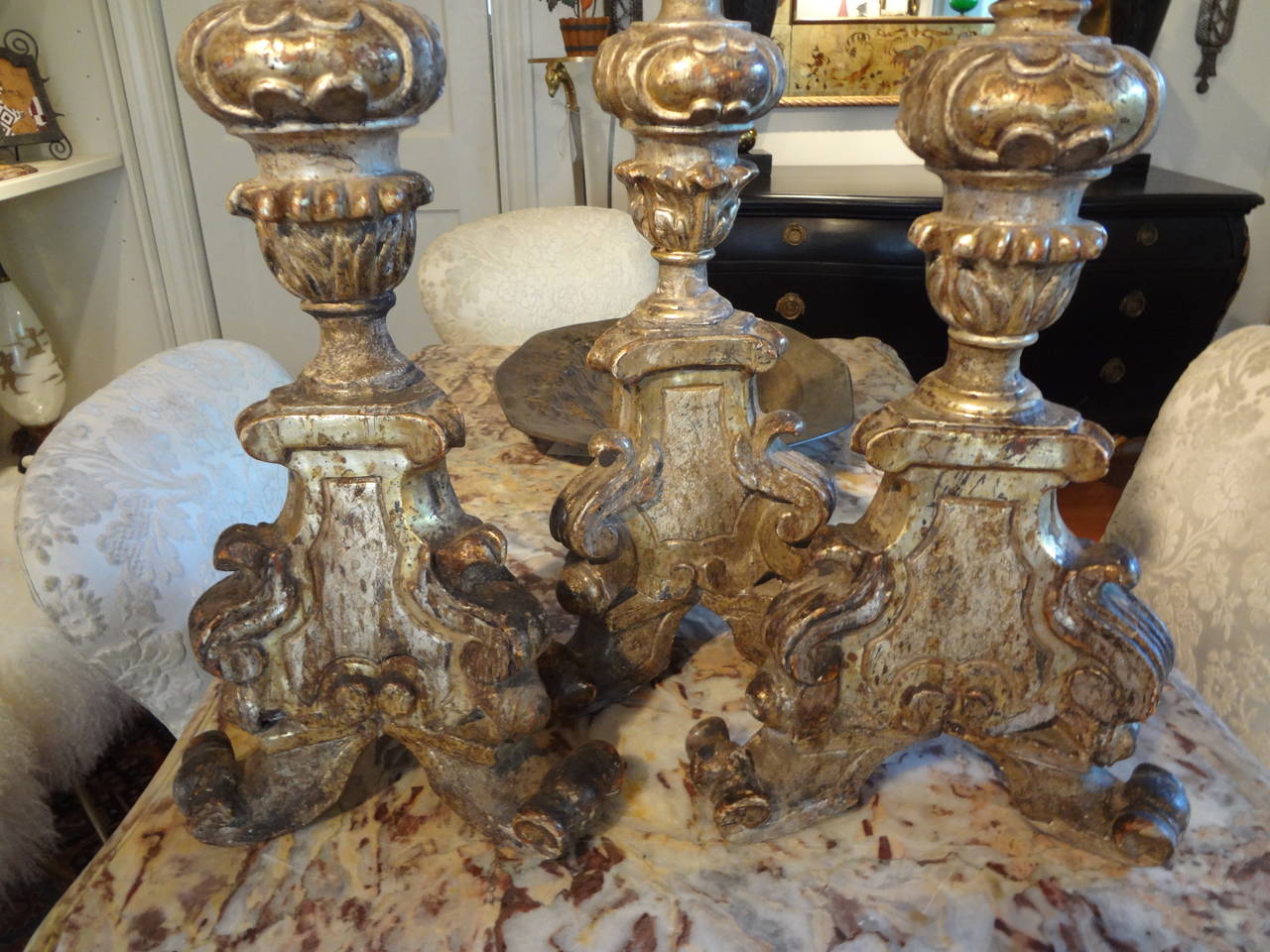 Set of three antique Italian Baroque style silver gilt candlesticks from the 18th century. Each 18th century Italian silver leaf candlestick or altar stick is slightly different as they are hand carved.

 