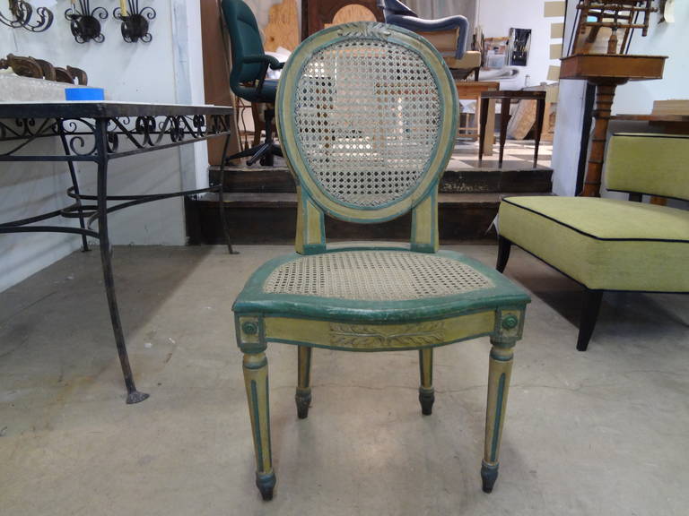 Lovely French Louis XVI style painted cane chair from the 19th century.

Please click KIRBY ANTIQUES logo below to view additional pieces from our vast inventory.