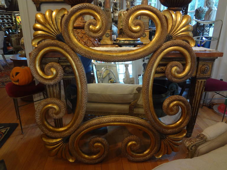 Unusual Italian carved giltwood mirror with fabulous patina.