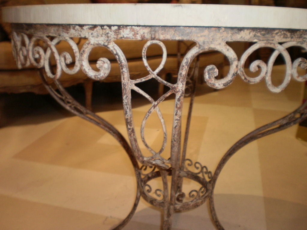 GRACIOUS FRENCH WROUGHT IRON GARDEN TABLE WITH MARBLE TOP