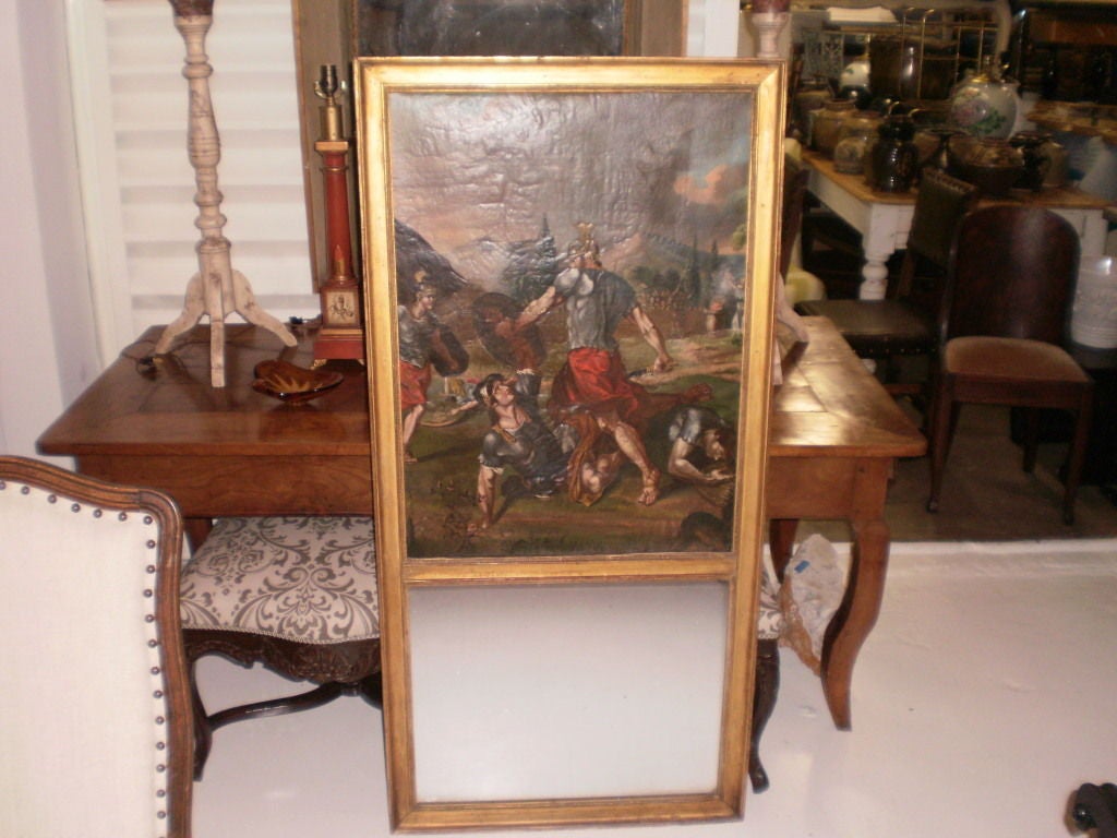 Unusual 18th century French Louis XVI Trumeau mirror.
Handsome most unusual 18th century French Louis XVI giltwood trumeau mirror with a gladiator scene. This rare antique French masculine Neoclassical style gilt wood trumeau mirror is very unusual