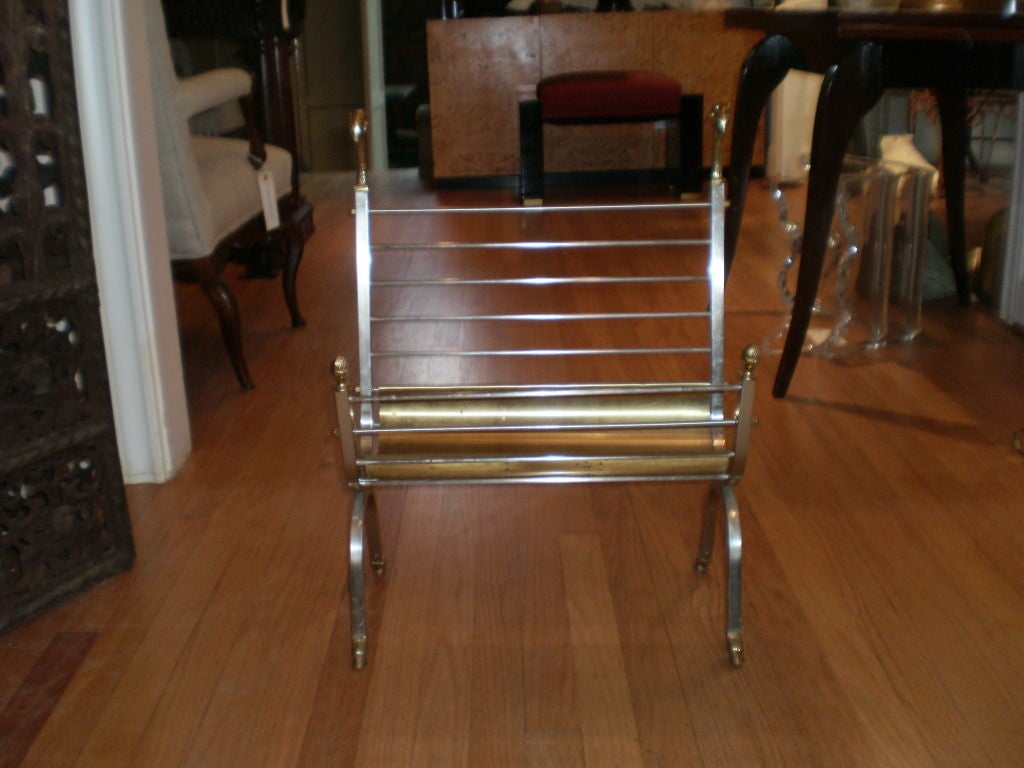 Hollywood Regency steel and brass magazine stand or magazine rack with brass ram’s heads and paw feet after Maison Jansen.
This midcentury Italian magazine rack would look equally at home in a contemporary or traditional interior.
 