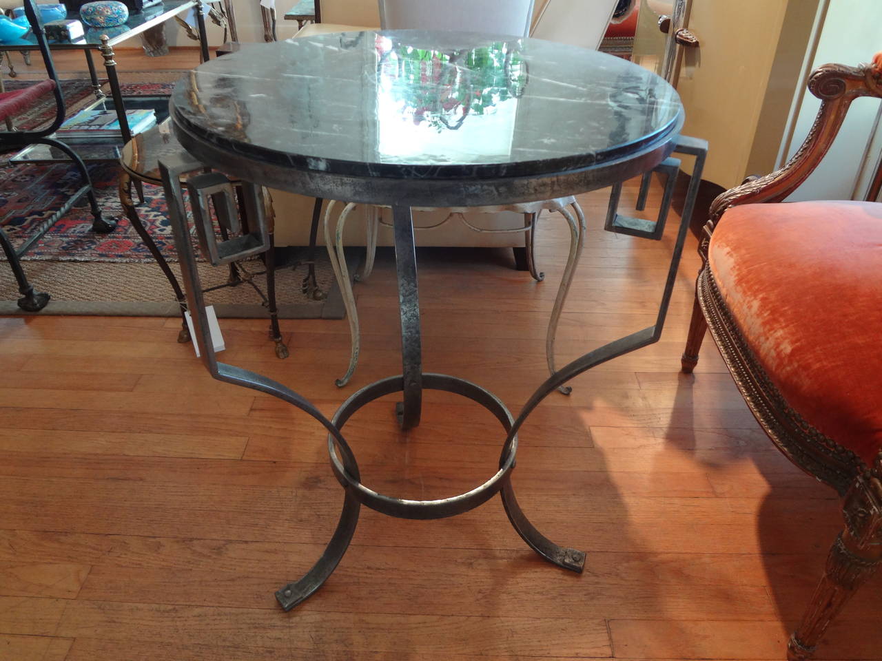 Chic French Neoclassical style steel table with Greek key design and marble top.

Please click KIRBY ANTIQUES logo below to view additional pieces from our vast inventory.