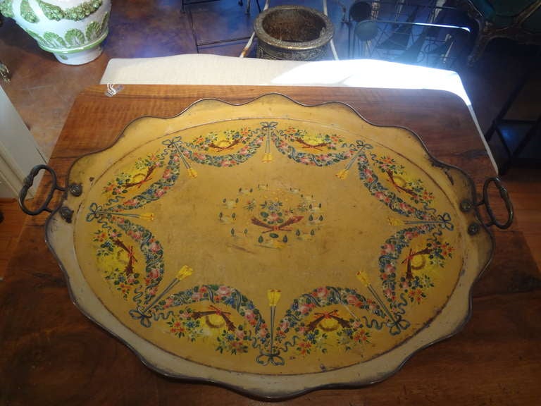 Large French Louis XVI Style hand-decorated tole tray with bronze handles from the 19th century. Gorgeous colors!

Please click KIRBY ANTIQUES logo below to view additional pieces from our vast inventory.