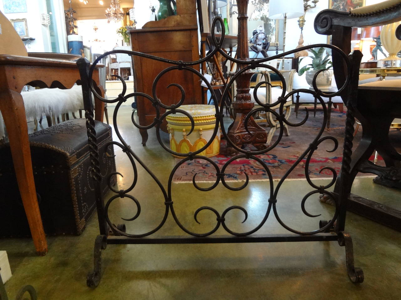 Hand-forged wrought iron firescreen from Provence.

Please click KIRBY ANTIQUES logo below to view additional pieces from our vast inventory.