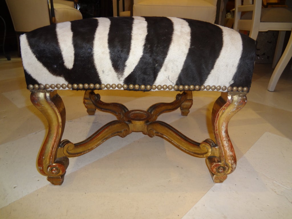 Chic 19th century French Louis XIV style gilt-wood tabouret/stool/bench covered in zebra hide. 
