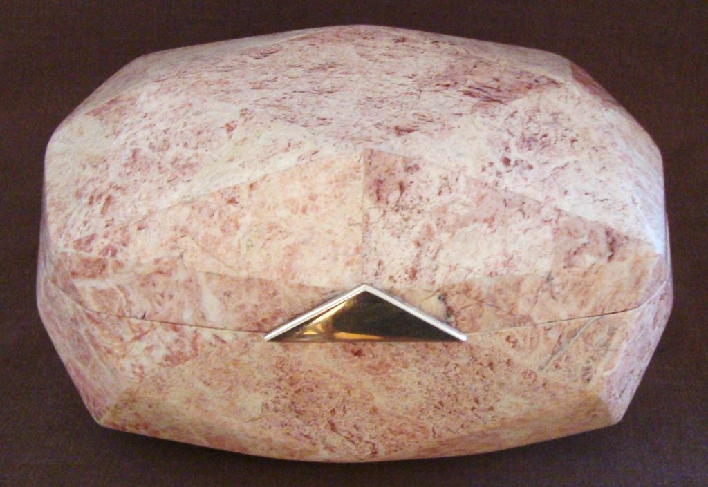 Fabulous 1970's tessalated marble box in the style of Karl Springer.  This box has a very unusual gem-faceted design, with multiple polyhedron sides.  Marble is a soft coral pink color, with tons or rich veining and figuring.  The interior is a dark