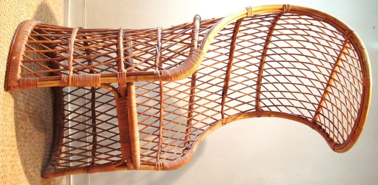Unusual 1960's Italian wicker and rattan hooded canopy chair.  A very sculptural form, and interesting from every angle.