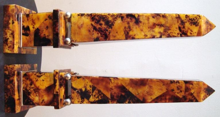 Wonderful pair of 1970's faux tortoise shell obelisks with nickel plated accents.  These are veneered in penshell, which is beautifully laid out in diagonally cut pieces to replicate real toroise, with tons of depth in the color.  Great dramatic