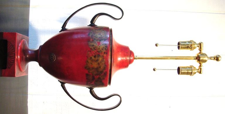 Wonderful tall urn shaped lamp, France 1940's, constructed of cherry red painted tole with black wroght iron handles.  Great hand painted gold floral details on body of urn, with additional bell flower details on handles, all atop square platform