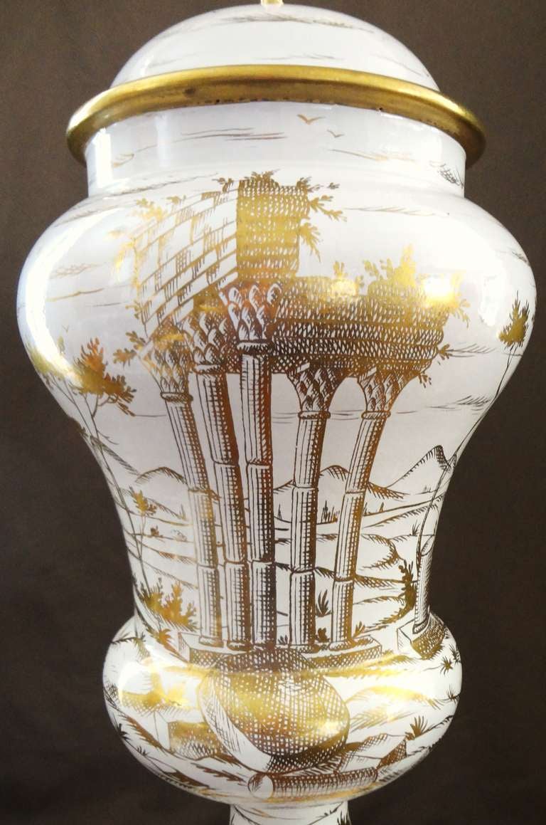 Monumental 1950's table lamp in hand thrown glazed terracotta with hand painted gilt decoration by famed Italian ceramicist Ugo Zaccagnini.  The designs feature classical ruins, village, and trees/foliage, and is very reminiscent of art work from