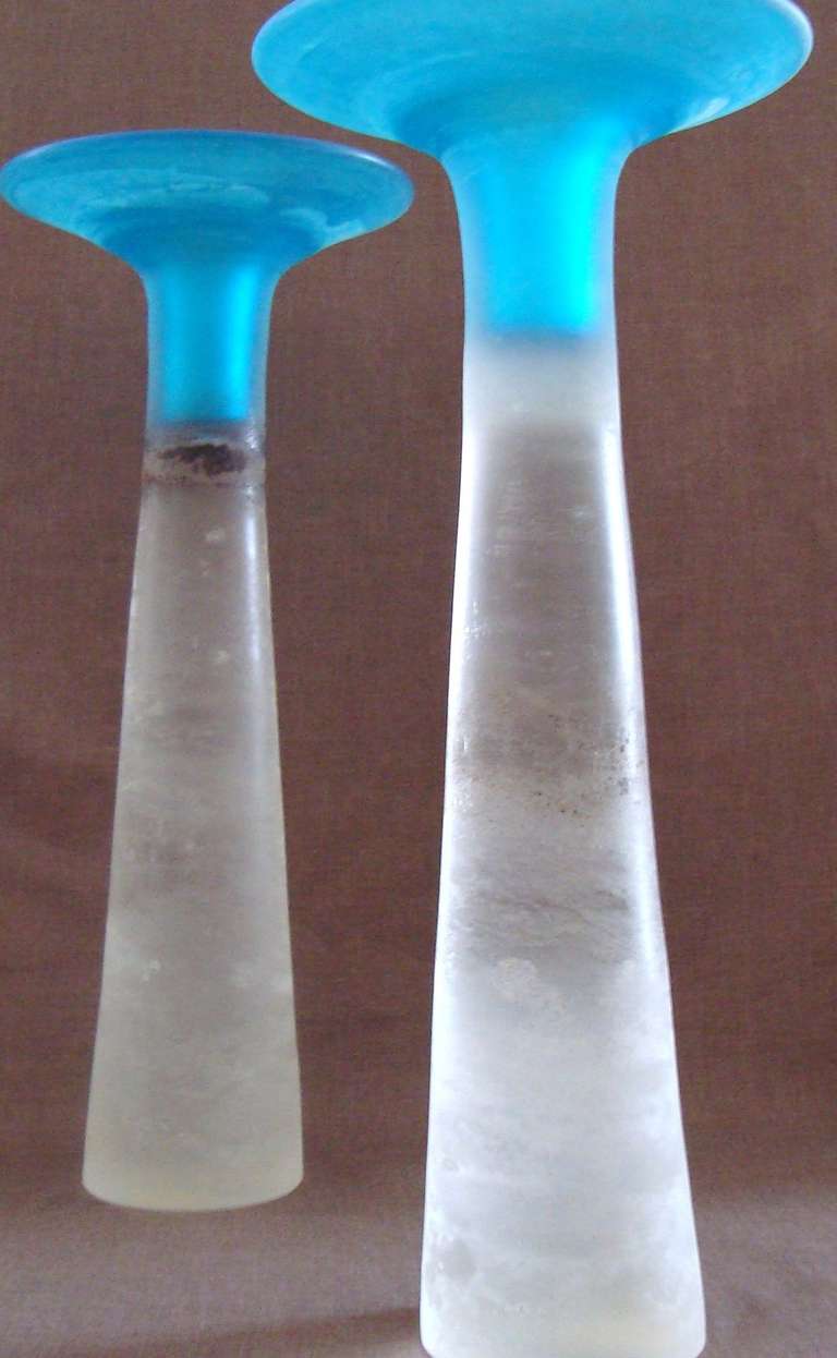 Unusually large scale pair of Gino Cenedese candle stick holders with scarce double technique of Scavo surface and Sommerso coloring. Gorgeous corroded surface, creating the illusion of rock crystal. These are solid glass and very heavy, with one