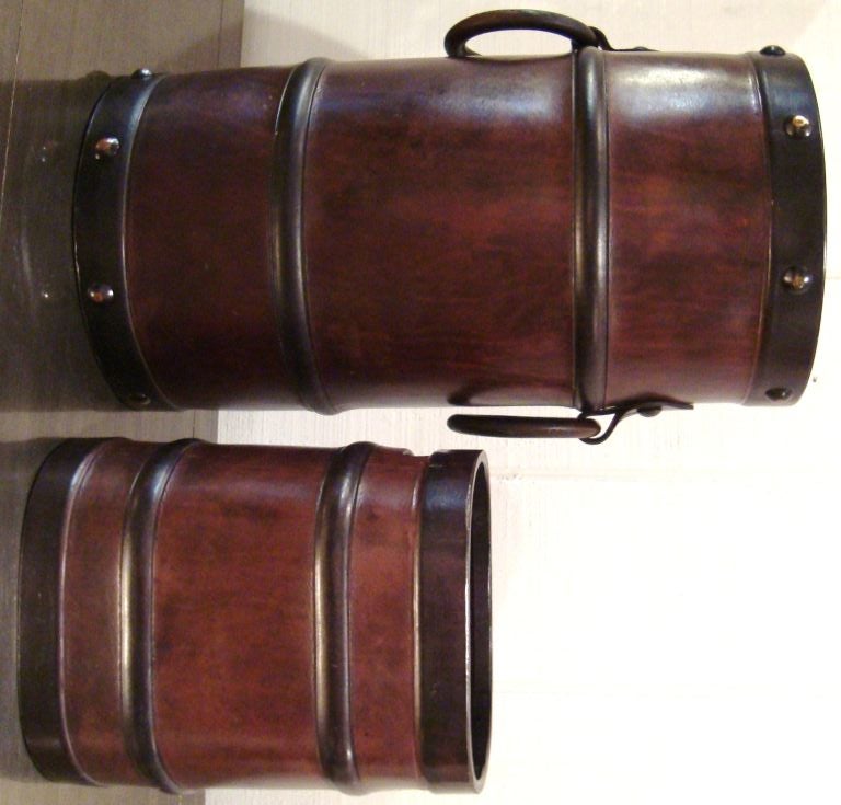 Great set of a 1950's leather umbrella stand and wastebasket, constructed of thick, hard-sided saddle leather and done in an interesting trompe l'oeil 