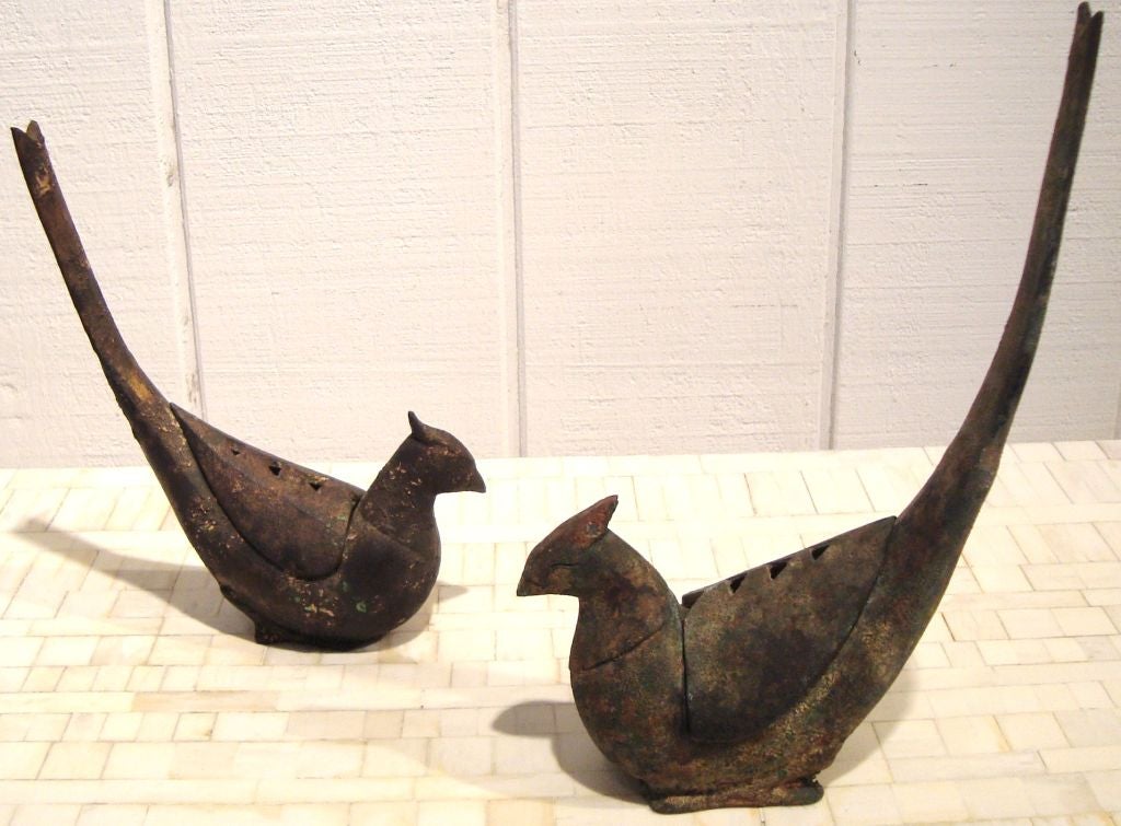Interesting pair of Meiji period style patinated cast iron pheasant incense censers, Japan, 1960's.  Birds are in two sizes, with larger dimensions listed below.  Removable covers with pierced triangular details to release smoke.  Charming modernist