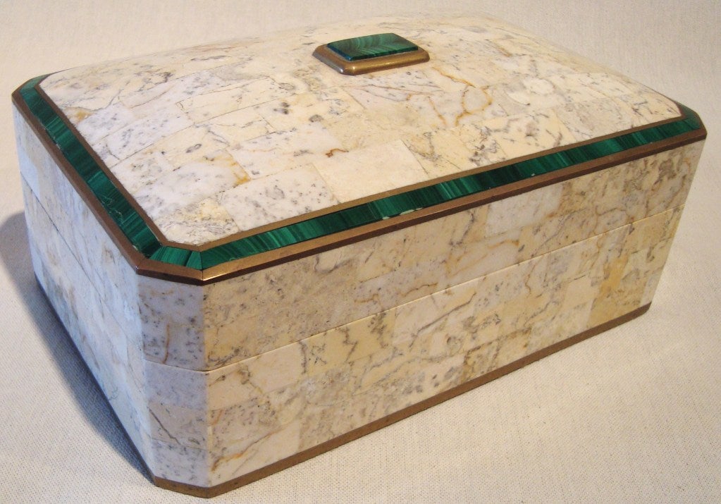 Beautiful Maitland Smith box made out of tessellated coral with malachite inlay and malachite cabochon on top, all edged in brass trim.  Great lines with canted edges and a curved dome top, with a rich golden mahogany interior.