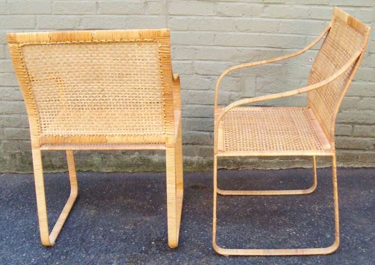 Set of Four 1970's Harvey Probber Woven Rattan Dining Chairs

Arm height is 25 1/2