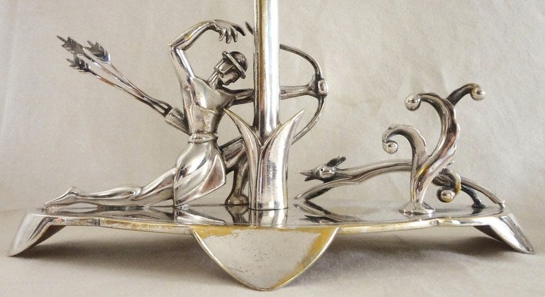 Stunning and stylish pair of 1930s silver sculptures by famed German sculptor and metal smith H. Ottmann. These pieces epitomize Art Deco glamour in all of its fascinating forms, and are very much in the school of Ottmann's European counterparts,