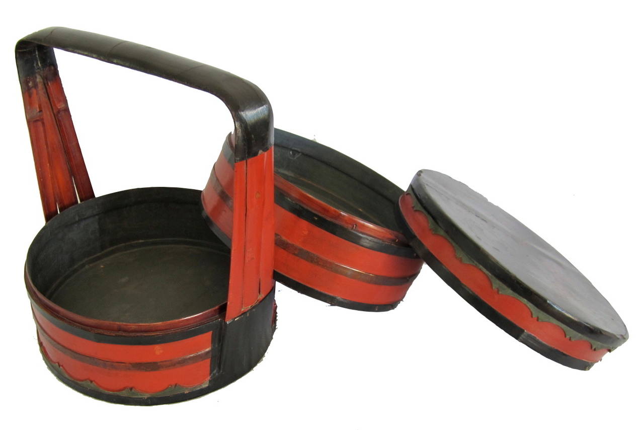 Black and red lacquered bamboo multi-layered food baskets with original gold painted lids.