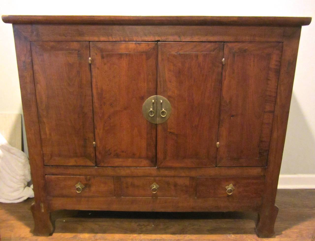 Walnut wood cabinet with brass hardware, from the Gansu province, China. Exceptional patina and excellent condition.