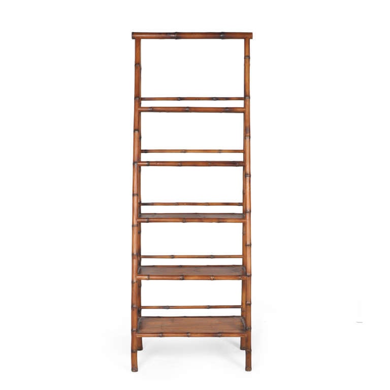 Stepped bamboo etagere with five shelves of graduating dimension. The deepest shelf measures 13.5