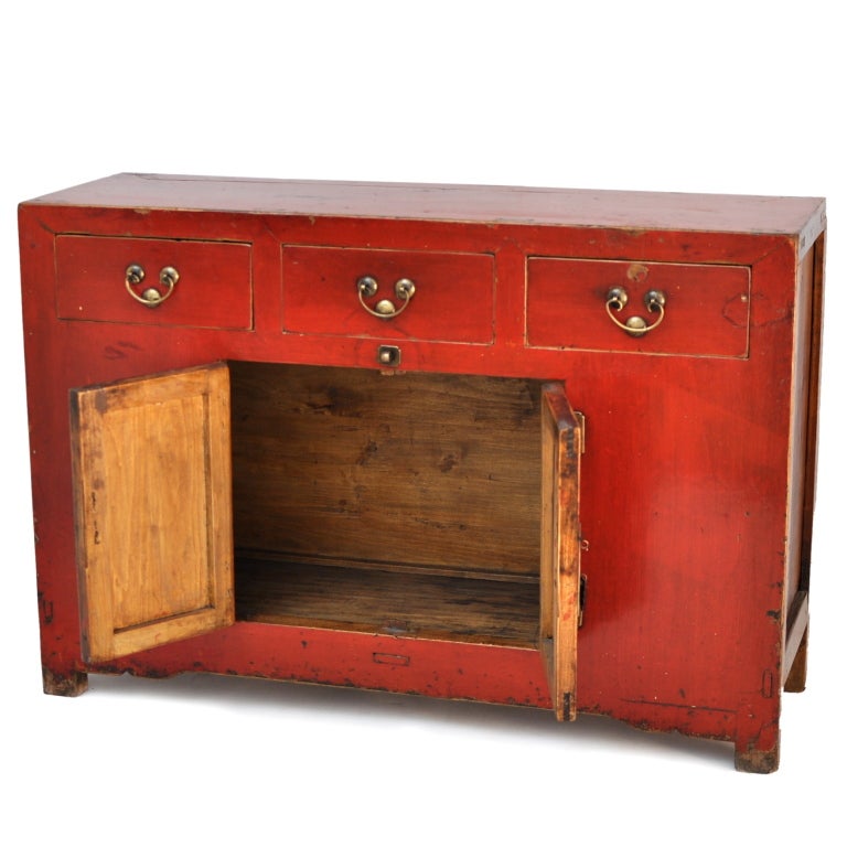 Red Lacquer Sideboard/Buffet with Three Drawers and Brass Hardware. This striking piece retains its original lacquer finish.