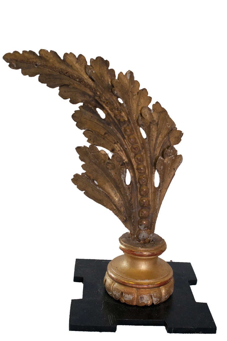 Set of four gilt architectural elements in the form of beaded acanthus leaves.