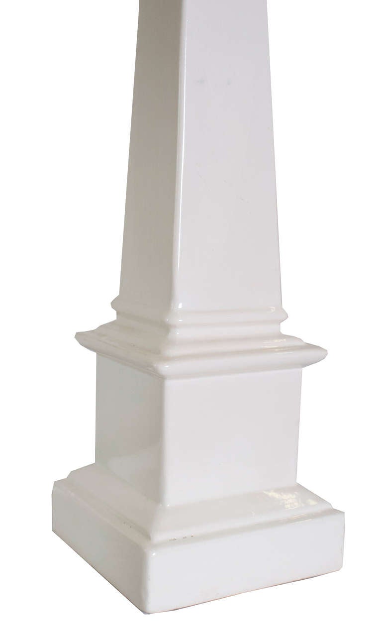 A Pair of White Ceramic Taper Column Table Lamps.
27" High to the top of the socket.  With shade higher.