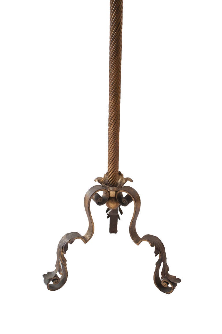 Single wrought iron floor lamp with decorative base. 
Height to top of socket is 51.5"  Height to top of lamp shade 62.75"