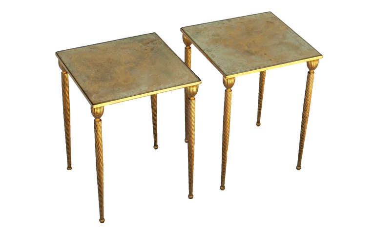 A set of three brass side tables with gilt tops, the largest table could,
be used as a coffee table.

The pair of tables are: 11.88 inches Square  x 15.75 inches High