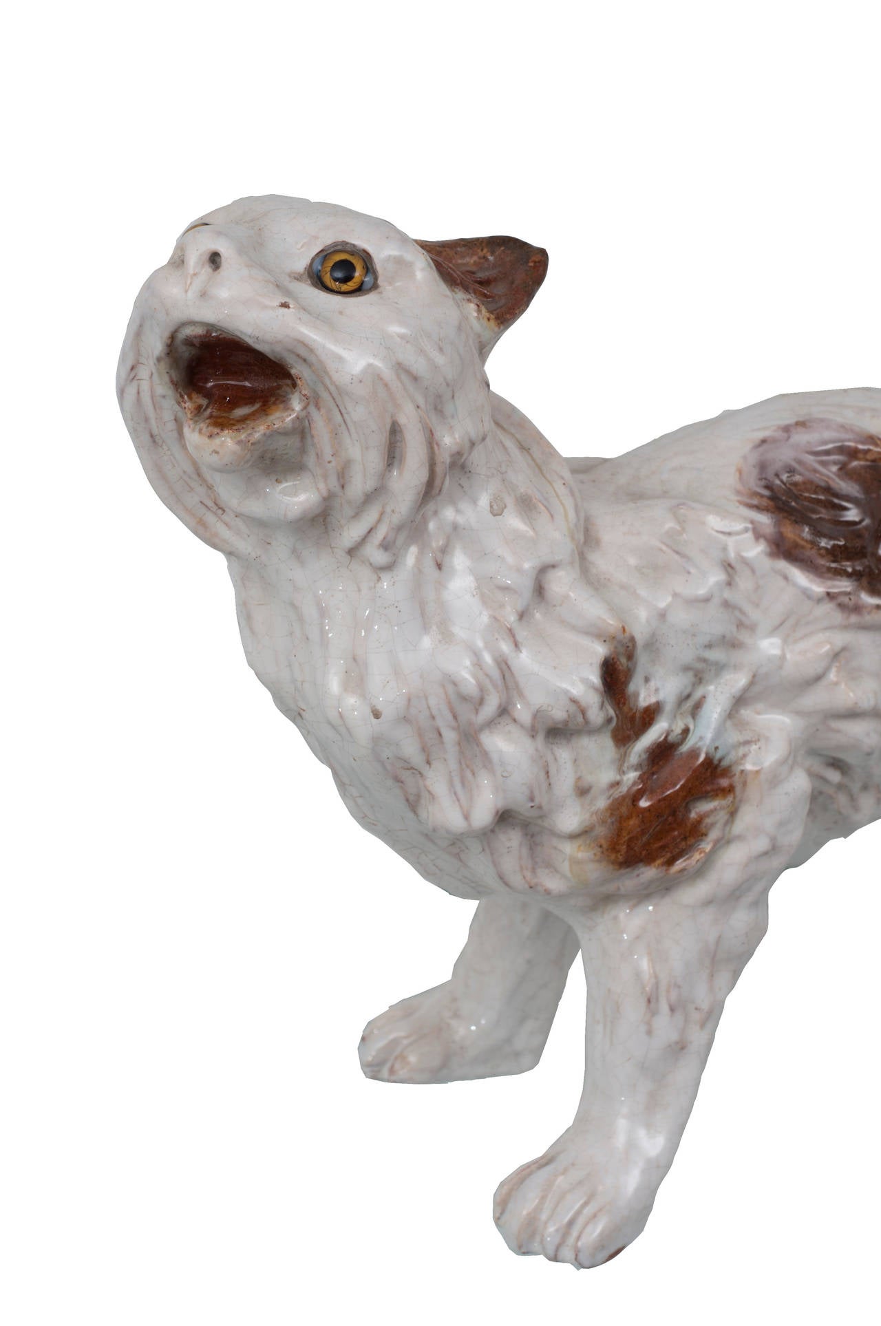 A bavent brown and white enameled ceramic cat. Bavent is a town in Calvados Department of Basse, Normandy in Northwest of France and is well known for this type of ceramic animals that are put on the roof.