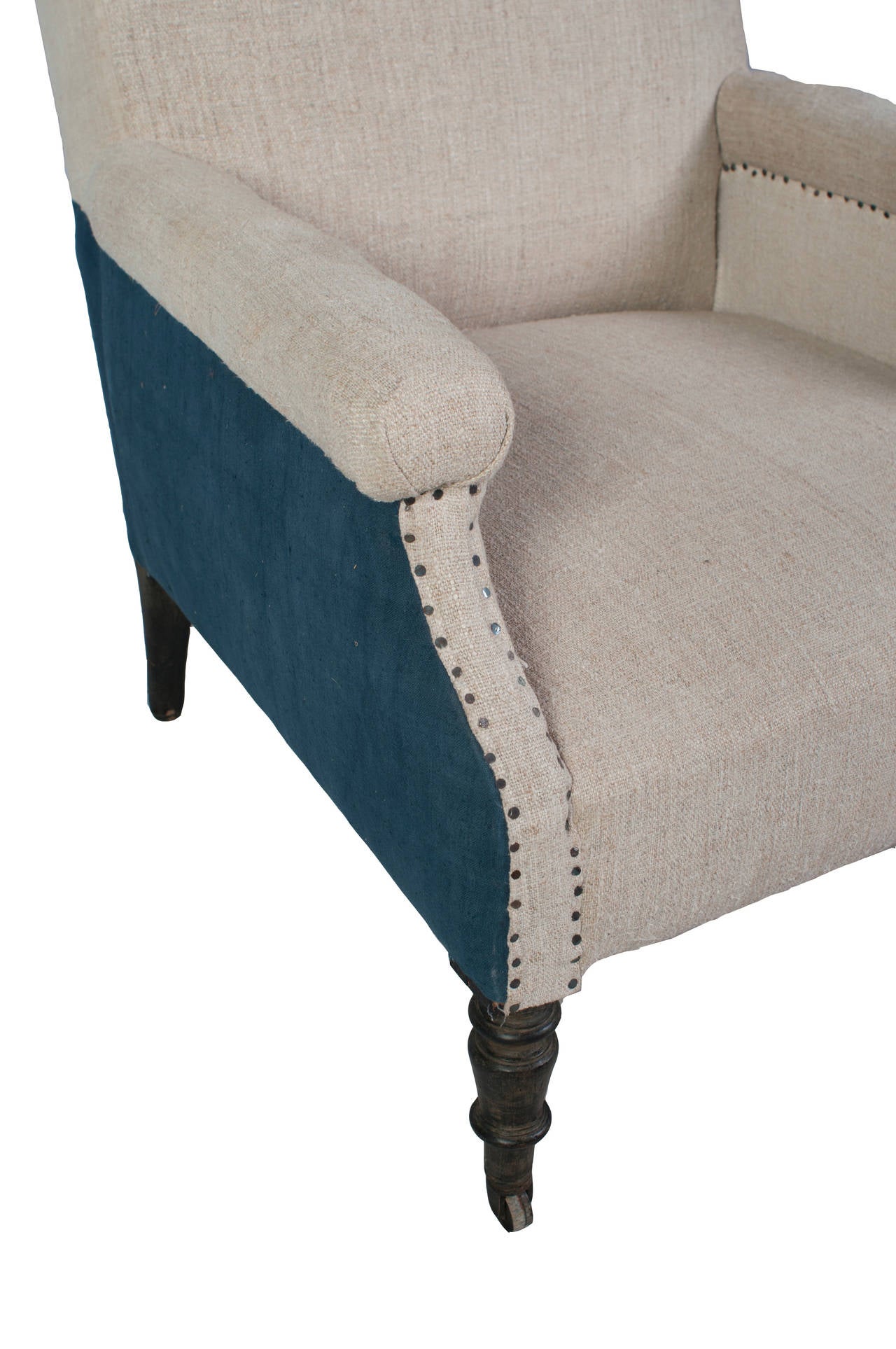 A single Napoleon III fauteuil, new upholstery and casters.