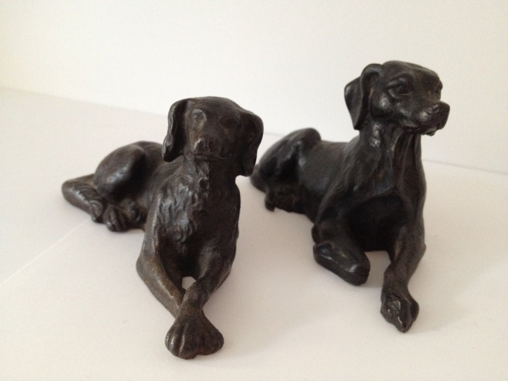 Minature Cast iron dogs<br />
Large Sitting w/base:  Dog H8.5"xL7" $1200.00<br />
Pair of sitting Dogs: H3"xL5" $ 700.00<br />
Jaunting Dog: H4"xL5"  $ 450.00<br />
Sitting Dog (no base): H4"xL5"  $ 500.00

WE