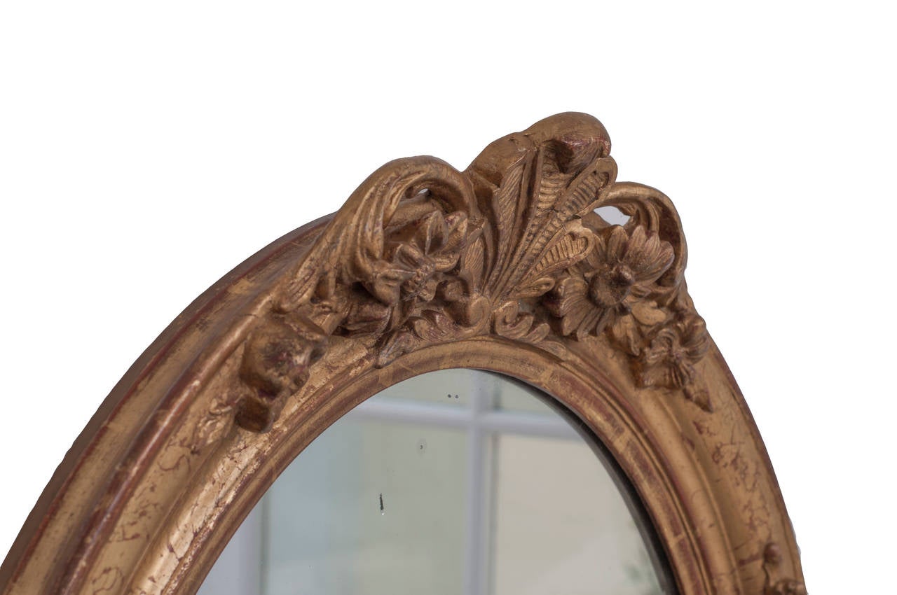 French Pair of Gilt Oval Mirrors For Sale
