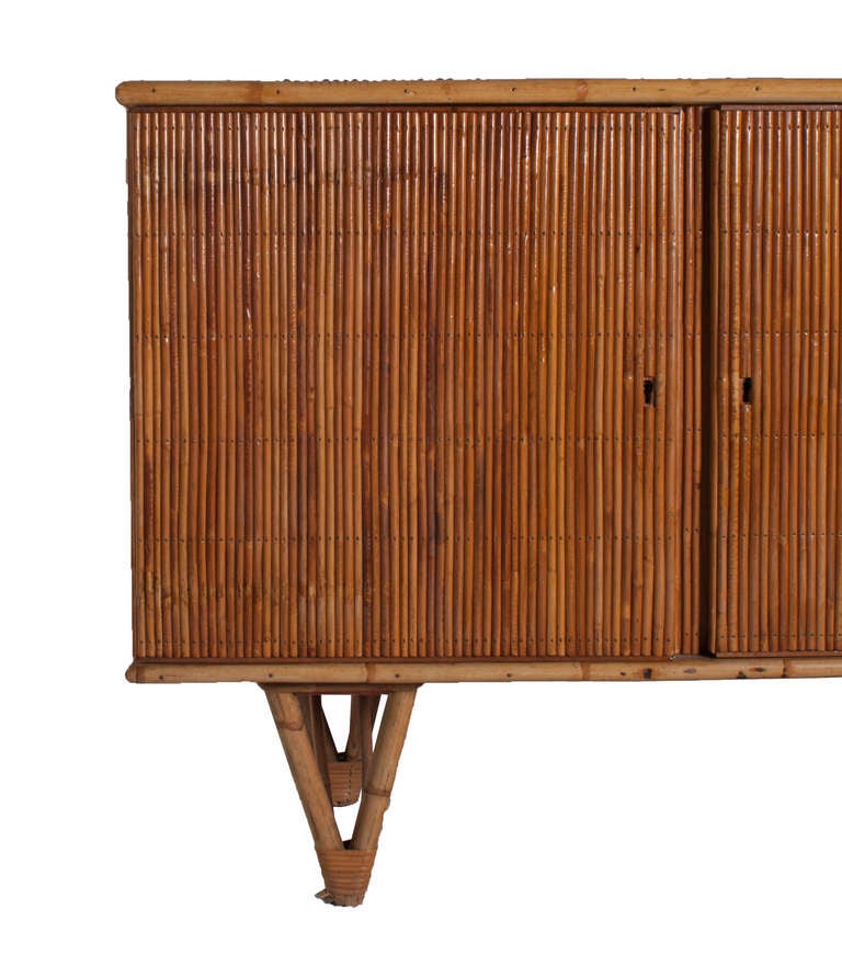 A French Bamboo Sideboard with the Manufacturer Initial Stamp on the back frame.  The company was quite well known in France during the 1950's-1960's for Bamboo Furniture.