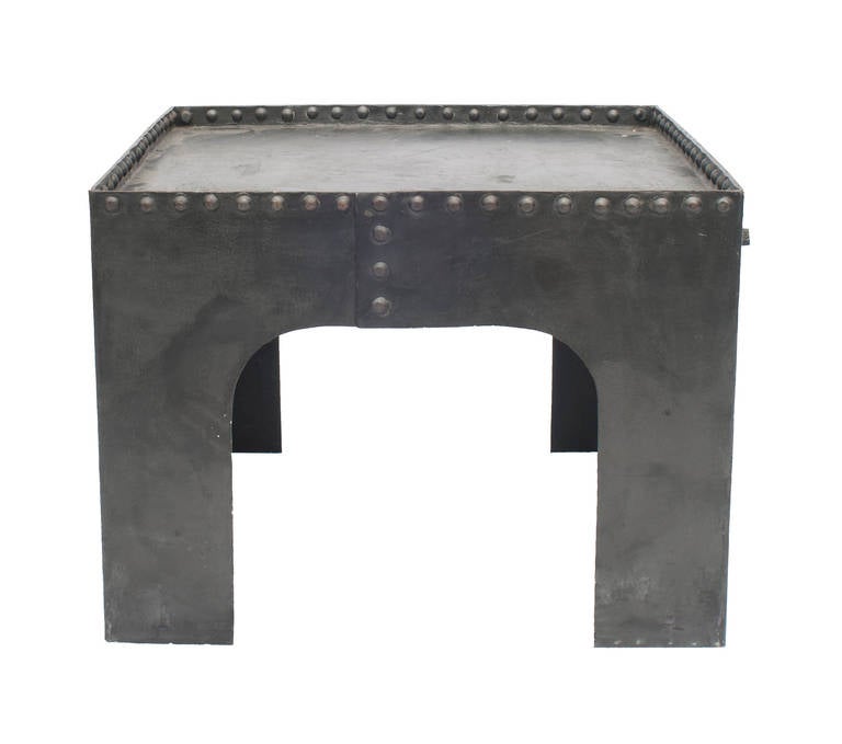 A small square Industrial coffee or side table with rivet decoration.