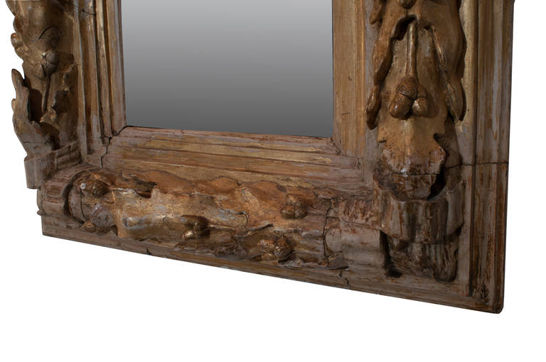 Very unusual heavy gilt carved wood mirror.
The frame is hand-carved with oak leaf and acorns.
All original patina, consistent with age.