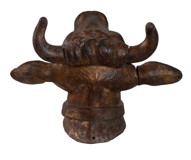 A gilt cast iron bulls head sculpture.
