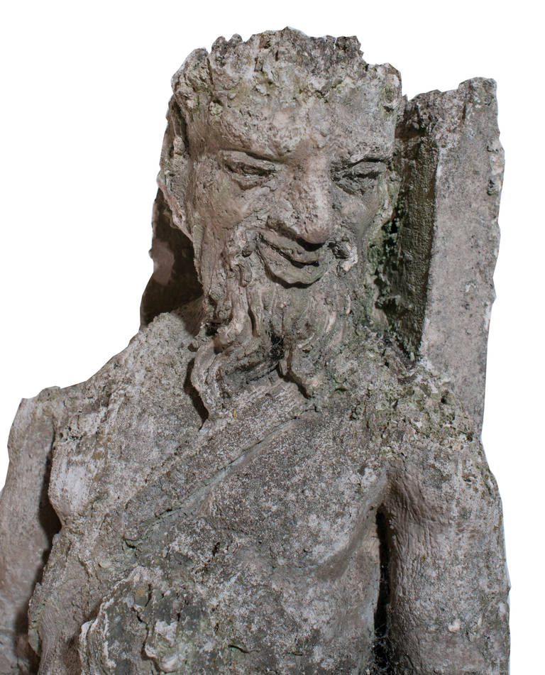 Sculpture en pierre calcaire d'un faune.