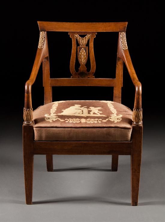 This smart-looking fauteuil is an excellent copy of a circa 1810 Italian neo-classic armchair.  The foliate hand carving is exceptionally well-done and is bleached to an ivory-like finish. While delicate in appearance, the chair is strong. The