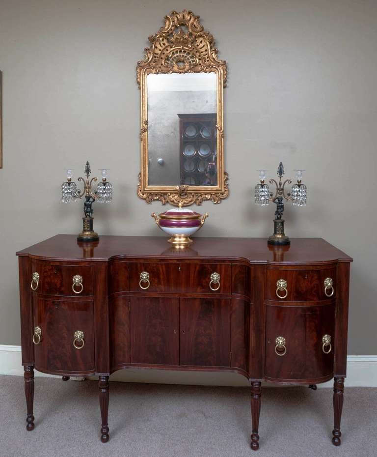 This beautiful sideboard was probably made in Boston and is similar to the sideboard shown in Henry Sargent's famous early 19th century Boston painting "The Dinner Party" (now in the Boston Museum of Fine Arts' collection). The piece has