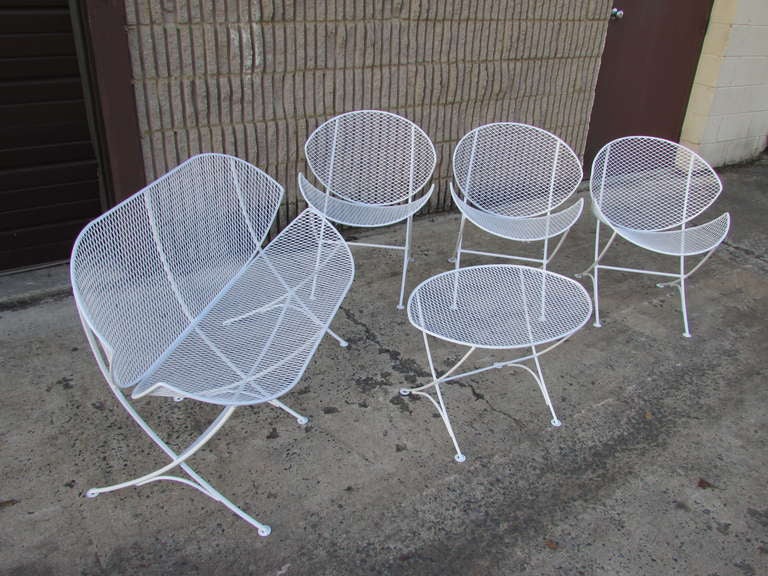 White set of metal garden furniture designed by Maurizio Tempestini for Salterini this set includes three chairs a settee and a table