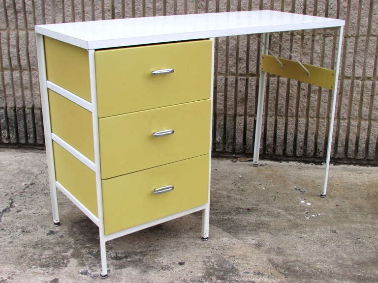 Yellow and white desk from the Steel Frame collection by George Nelson for Herman Miller
