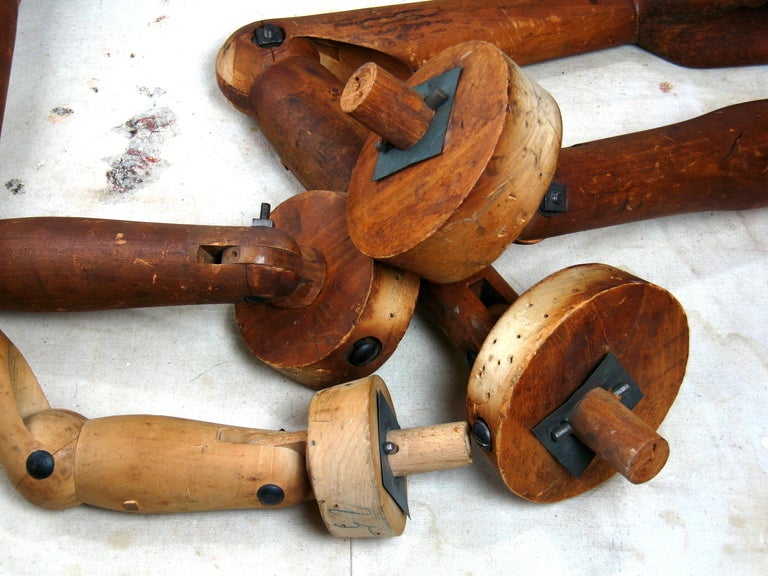 Collection of four antique wooden adjustable mannequin arms  with moveable fingers sizes vary with largest 32