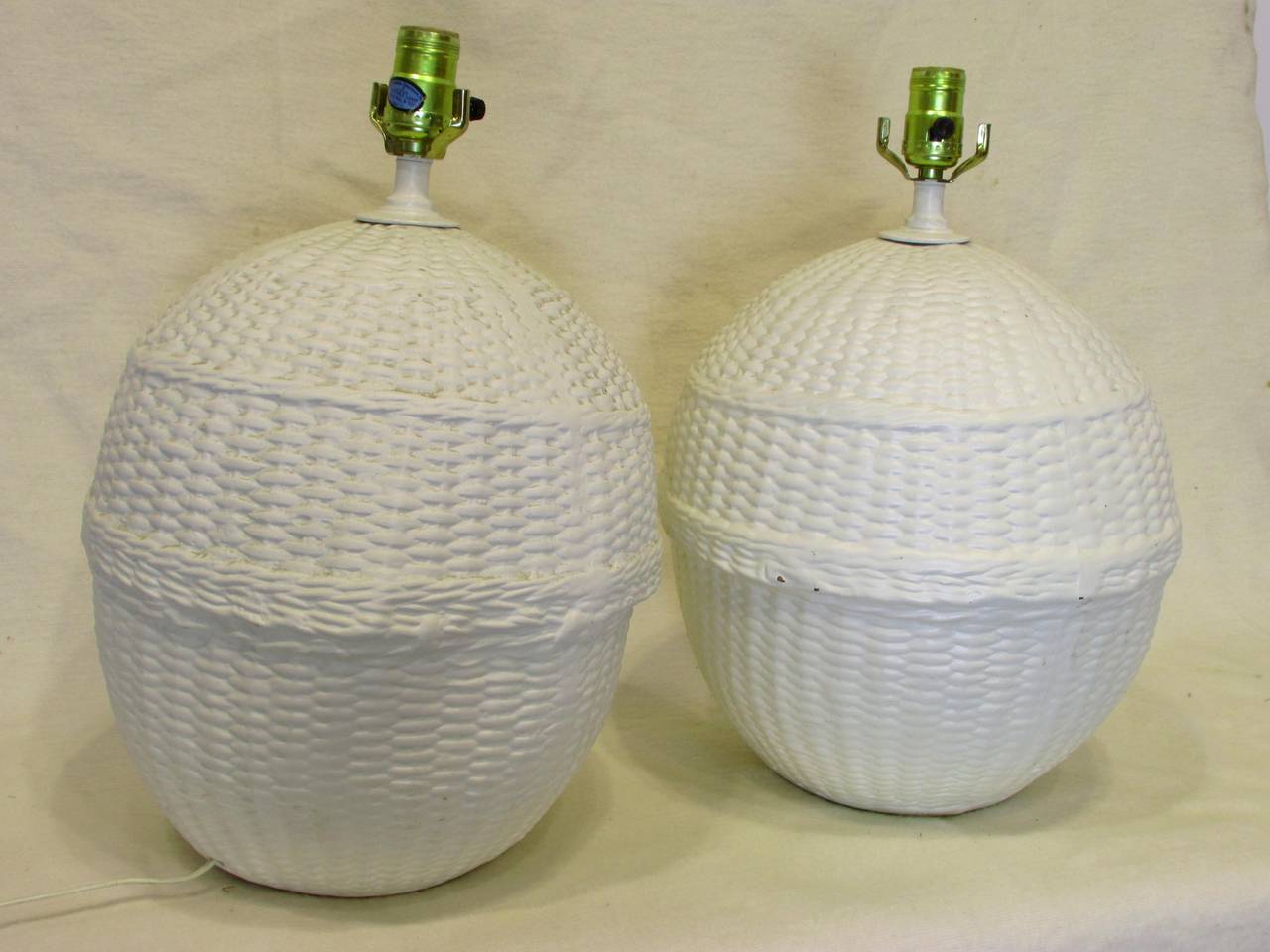 Pair of white painted ceramic basket weave lamps very much in the style of John Dickinson