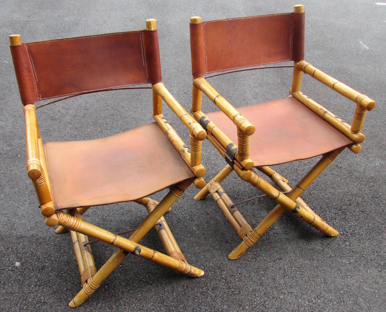 Stylish pair of director chairs made with bamboo frame and leather seat and back with brass hardware