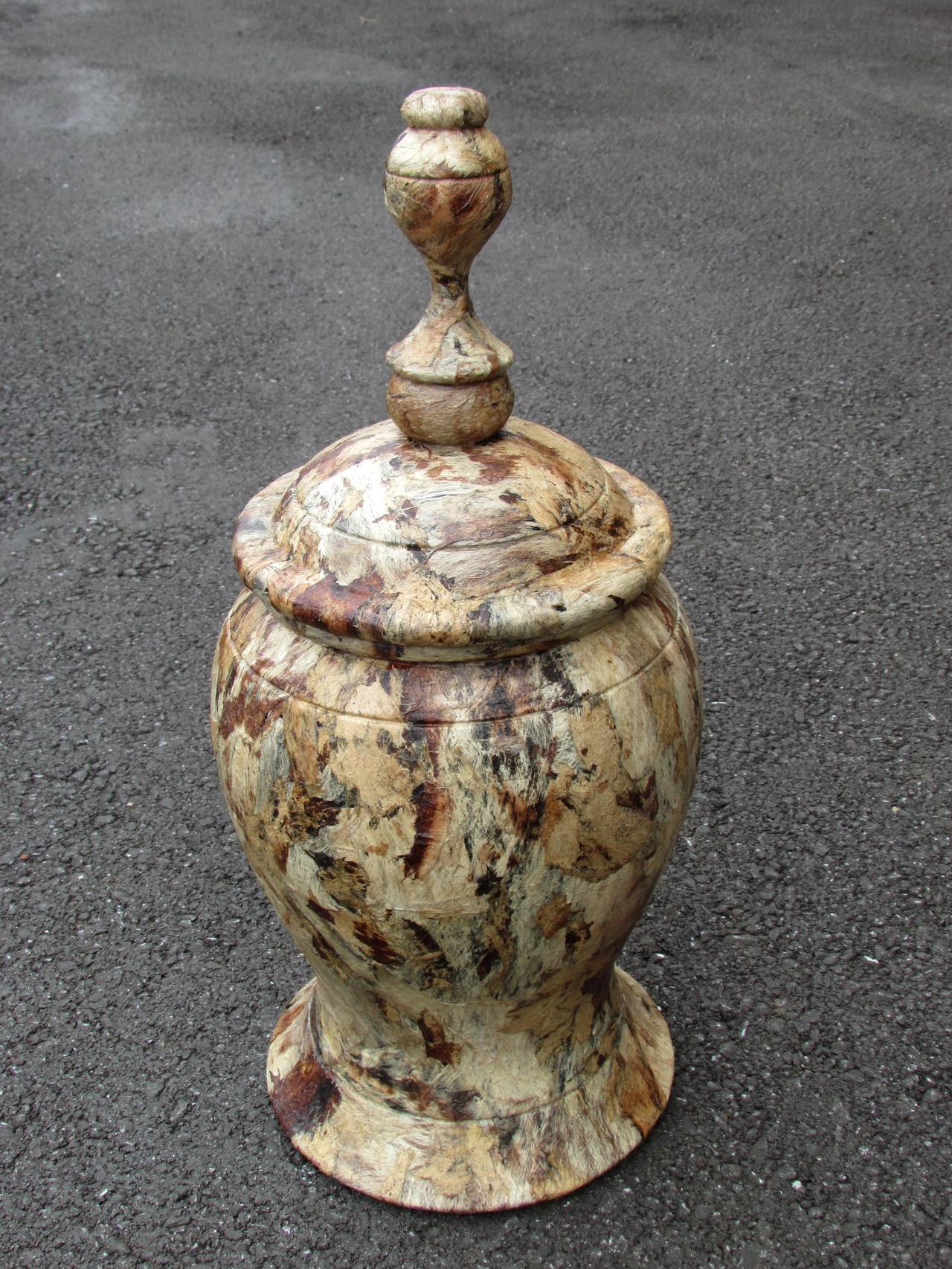 wooden turned urn with lid covered in bark fiber