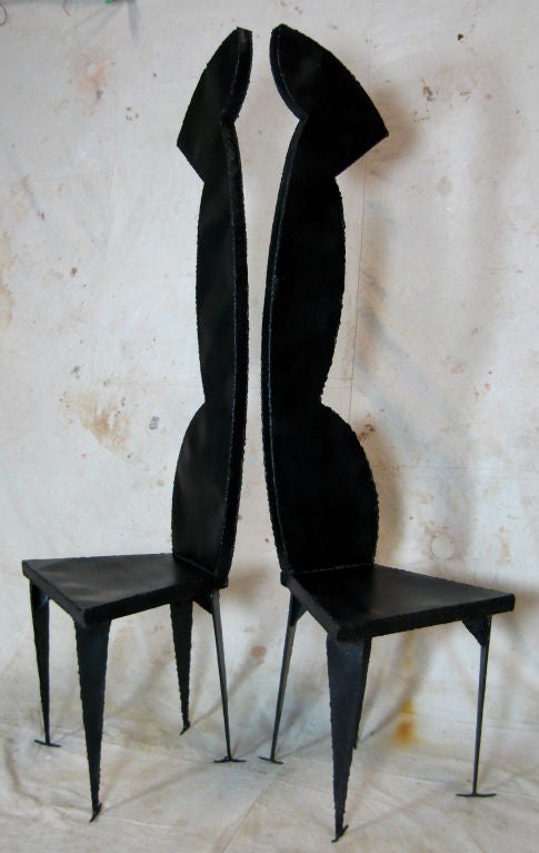 Very tall black painted abstract shape rough cut and welded metal artist made chair one available