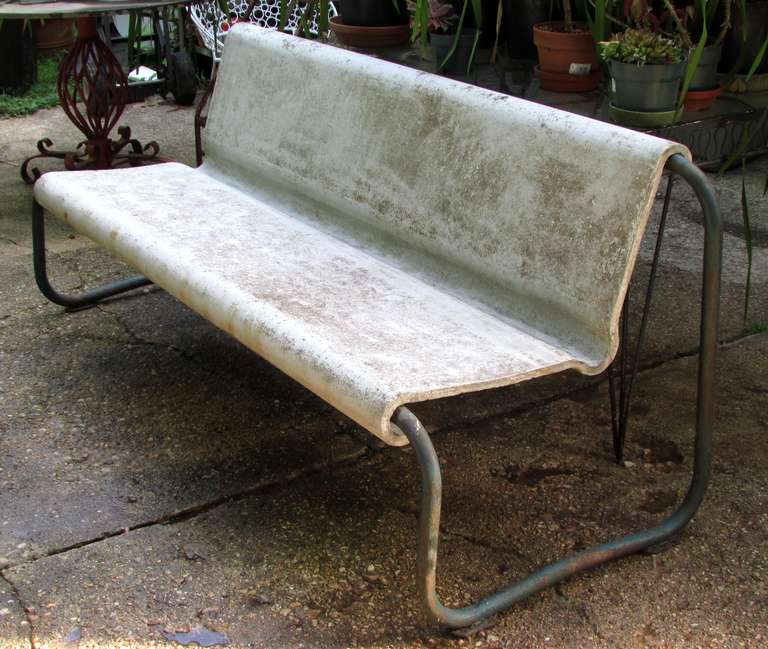 Rare bench with cast concrete seat over blue painted metal tubular frame by Willy Guhl
