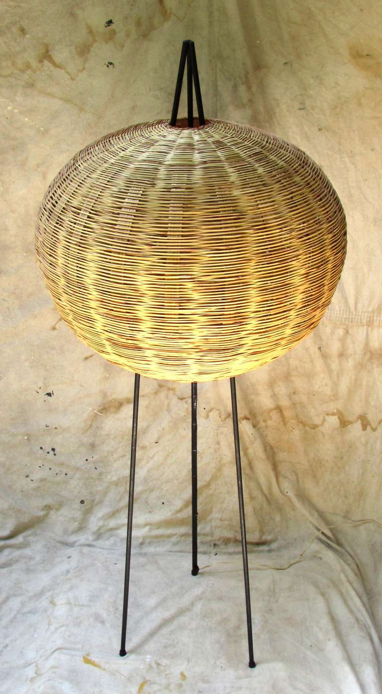 Large wicker ball over tripod metal lamp base these were made under a 1960's  Peace Corp program in Ecuador using local craftsman to make scandinavian designed mid-century modern design furnishings